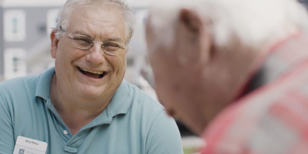 Residents laughing together at a Anthology of Beaverton community