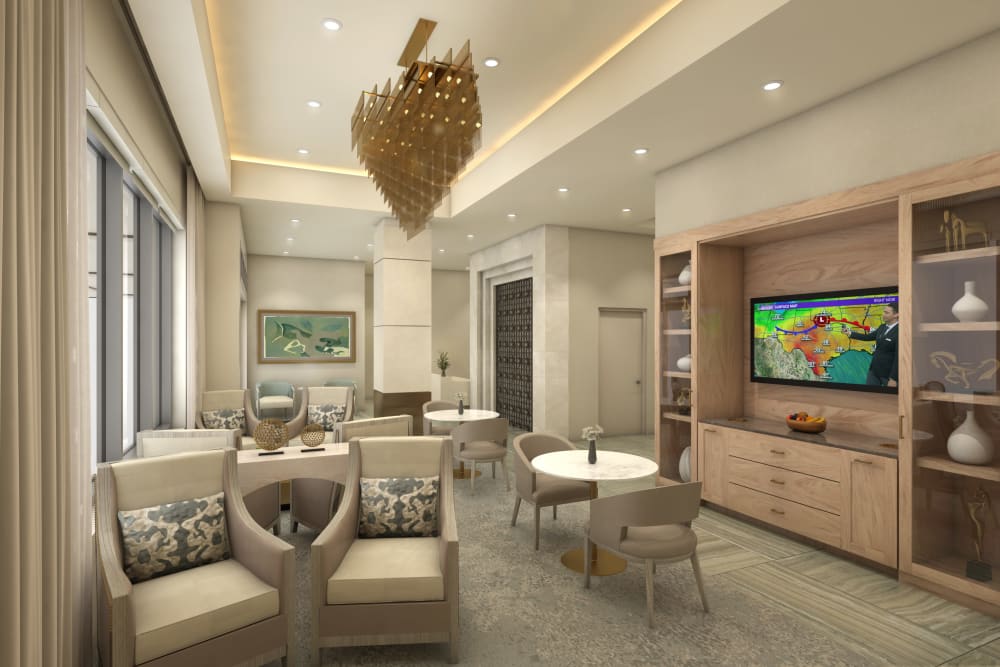 Lounge area with large television at Anthology of Highland Park in Dallas, Texas